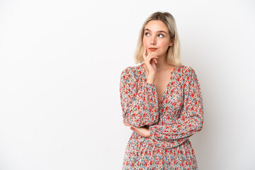 Young caucasian woman isolated on white background thinking an idea while looking up