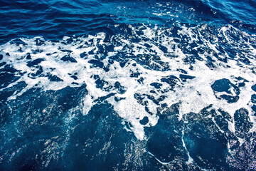 Bubble ripples of liquid shiny surface. Rippled reflect foamy abyss waters. Heavy sea splash depth...