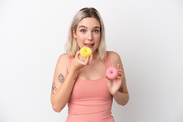 Young caucasian woman isolated on white background holding a donut