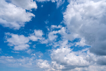 Naklejka na ściany i meble Clouds in the blue sky. Sky pattern