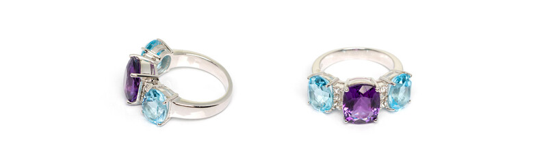 Amethyst with blue topaz and white sapphire Jewel or gems ring on white background. Collection of natural gemstones accessories. Studio shot