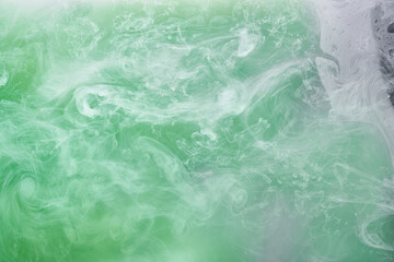 Green smoke on white ink background, colorful fog, abstract swirling emerald ocean sea, acrylic...