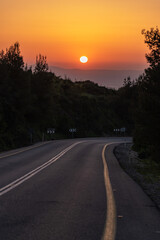 Road on Mount Gilboa as the sun goes down on a peaceful evening in Israel
