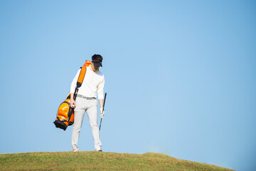 Asian professional golfer with golf club playing  golf