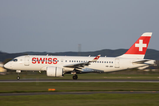 A Swiss Airbus A220 landing in Graz in Austria in beautiful evening light
