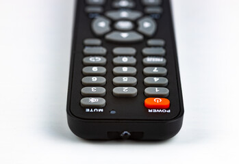 remote control close-up on white background, selective focus