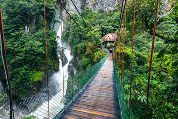 Suspended bridge in El Pailon del Diablo waterfall in Banos Santa Agua, Ecuador. South America.