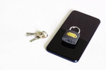 Modern mobile phone and padlock with keys on a white background. Concept of privacy and protection of digital information. Copy space. White background