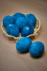 Blue painted eggs on a paper background