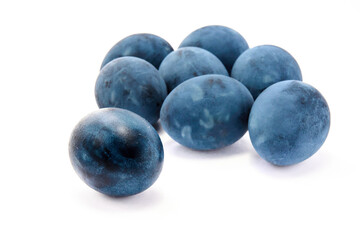 Group of blue painted eggs on a white background