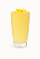Fresh Mango ripe organic yellow smoothie honey mix in glass. There is vitamin C. Garnish isolated on white background. Ripe mangoes are popular all over world. Perfect for summer drink. Healthy food.