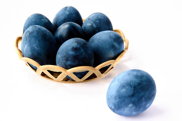 Blue painted eggs on a white background