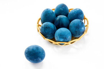 Blue painted eggs on a white background
