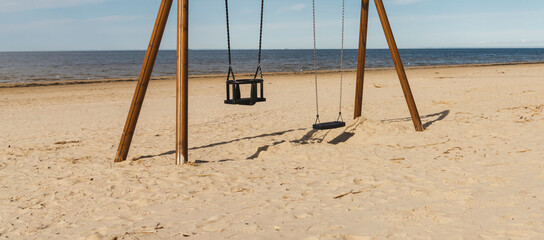 Swings on the seashore.