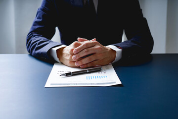 Businessman doing finances and calculate about cost to investment , business Financing Accounting Banking Concept, tax system