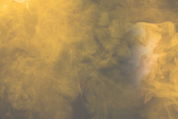 Yellow and pink steam on a black background.