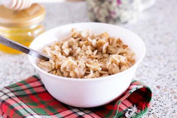 bowl of oatmeal porridge breakfast porridge food healthy muesli closeup morning nutrition