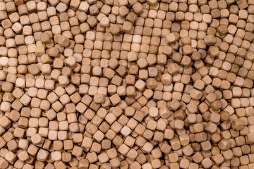 Hinoki cypress small wooden cubes chips for indoor sandpits sensory play playground. mini wooden cubes background