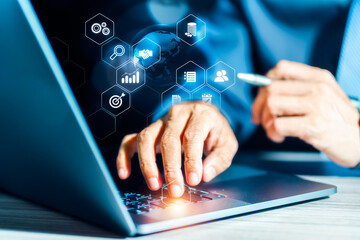Businessman is pointing virtual screen icons on Laptop Computer, digital marketing, financial, banking and big data