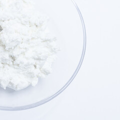 cottage cheese in a glass transparent bowl isolated on a white background