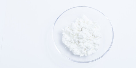 cottage cheese in a glass transparent bowl isolated on a white background