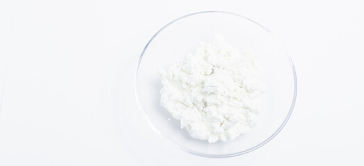 cottage cheese in a glass transparent bowl isolated on a white background