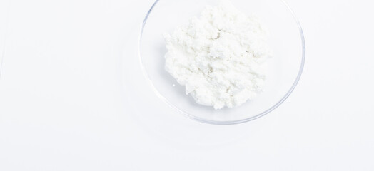 cottage cheese in a glass transparent bowl isolated on a white background