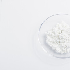cottage cheese in a glass transparent bowl isolated on a white background