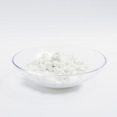cottage cheese in a glass transparent bowl isolated on a white background
