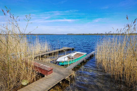 Schaalsee, Germany. Pier with boat. The lake was declared a biosphere reserve in 2000.