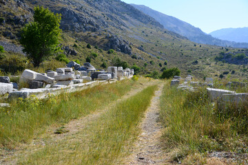 lonely road in mountains in hot summer day