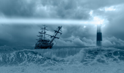 Old sailing ship at the stormy sea with lighthouse, strong sea wave  in the foreground  