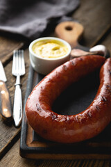 Grilled sausage with mustard sauce