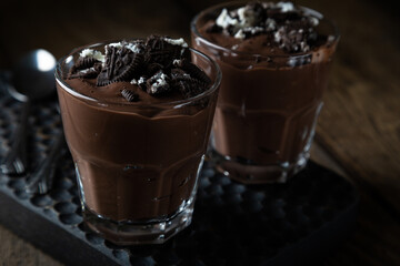 Homemade chocolate pudding with crumbled cookies