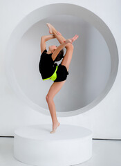 rythmic gymnastic girl performing in studio