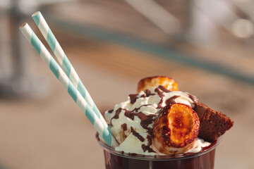 Chocolate milkshake with whipped cream, toasted marshmallows, and chocolate brownie 