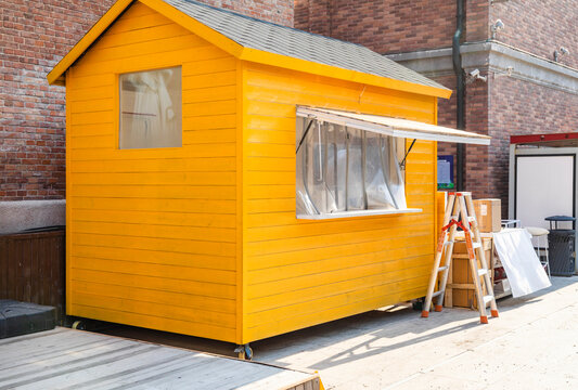 Yellow wooden kiosk hut building
