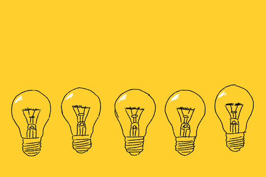 Set of light bulbs hand drawn on a yellow background.  Thinking, idea concept.
