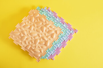 Massage floor mat, orthopedic, for stepping on feet, children's, cheerful multicolored pattern,yellow background