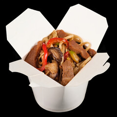 Food in a box. Wok with noodles, meat and vegetables.