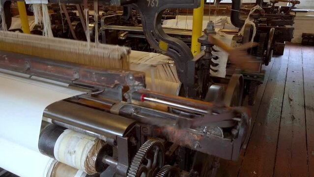 A cotton loom at a working textile mill, with audio. Seamless loop