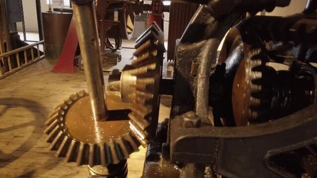 A working cotton mill. Bevel and spur gears distribute power to  the machines.
