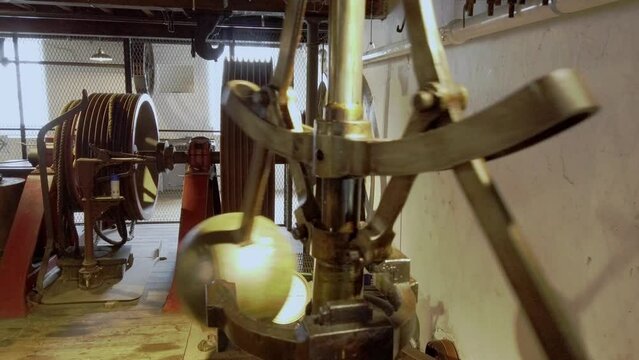 A working textile mill.  Spherical speed regualtors, spinning.