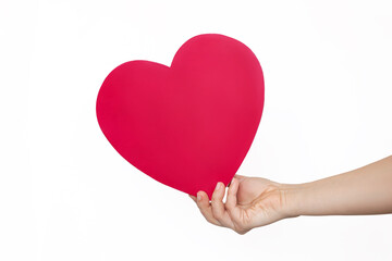 Human female hand holding a heart shape mockup with empty copy space for text and design isolated on a white color background. Feelings and emotions