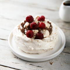 Homemade Pavlova dessert with raspberry and chocolate
