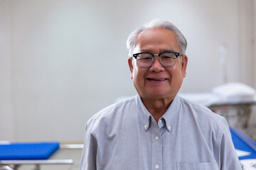 Portrait Asian senior man , old man , feel happy good health  on hospital background - lifestyle...