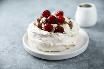 Homemade Pavlova dessert with raspberry and chocolate