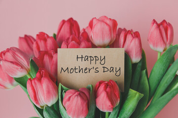 craft gift card with the inscription happy mother s day in a bouquet of bright beautiful tulips,...