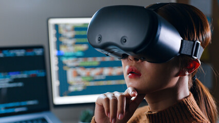 Young Asian woman, developer programmer, software engineer, IT support, wearing virtual reality...