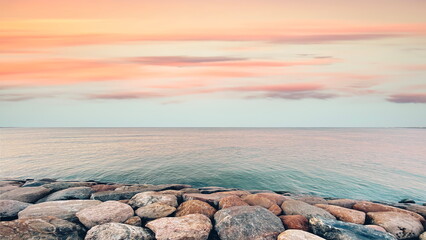 pastel  pink  sunset  yellow  blue cloudy  sky  reflection on sea  stones water nature background